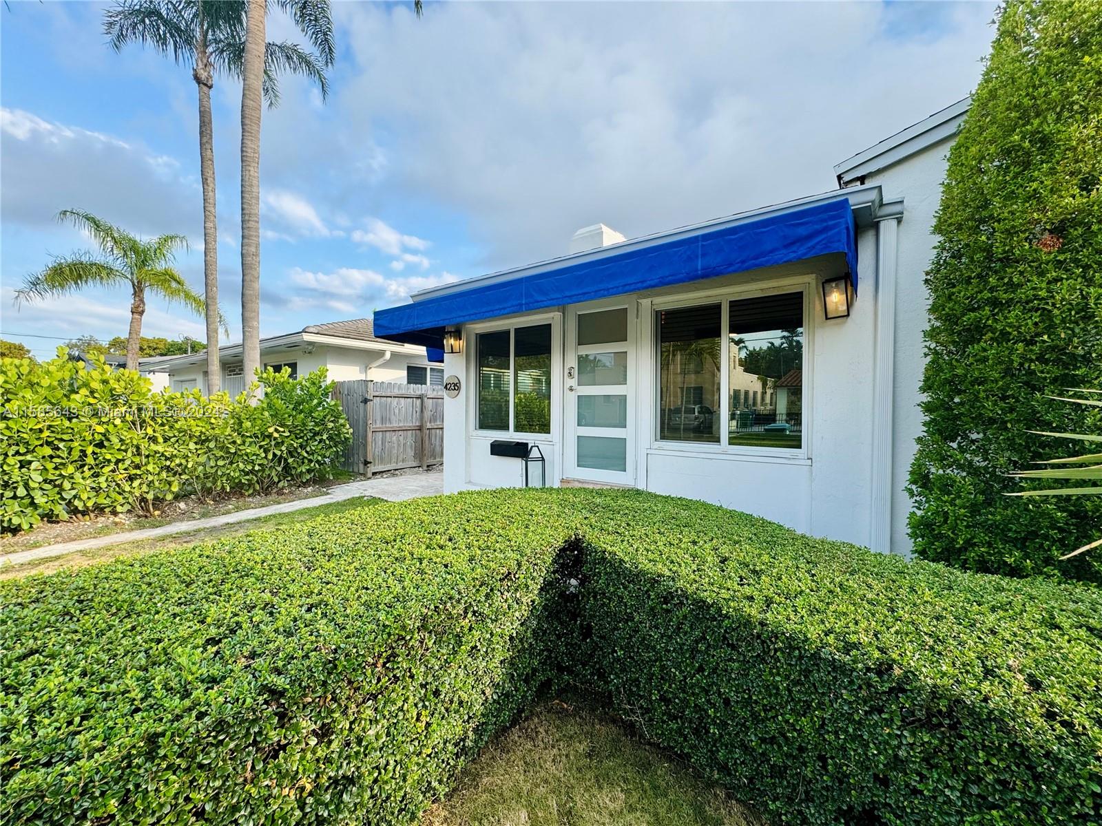 4235 Southwest 14th Street Miami, FL 33134 - Photo 8 of 32 a view of a backyard with potted plants