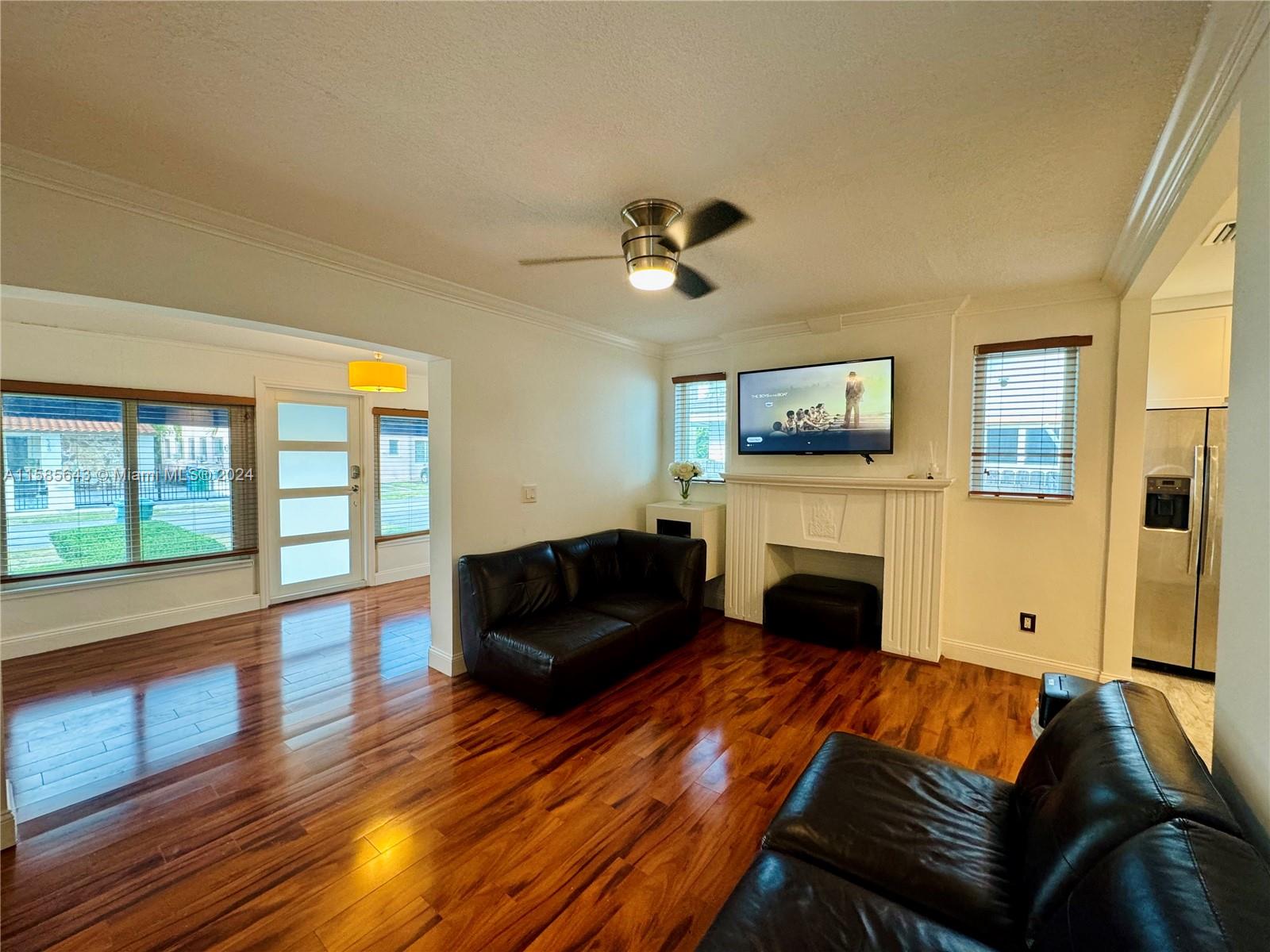 4235 Southwest 14th Street Miami, FL 33134 - Photo 9 of 32 a living room with furniture fireplace and flat screen tv