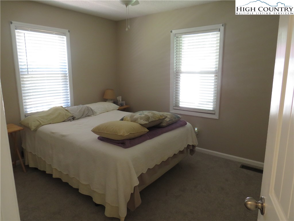 296 Silo Road Sparta, NC 28675 - Photo 15 of 24 a bedroom with a bed and window