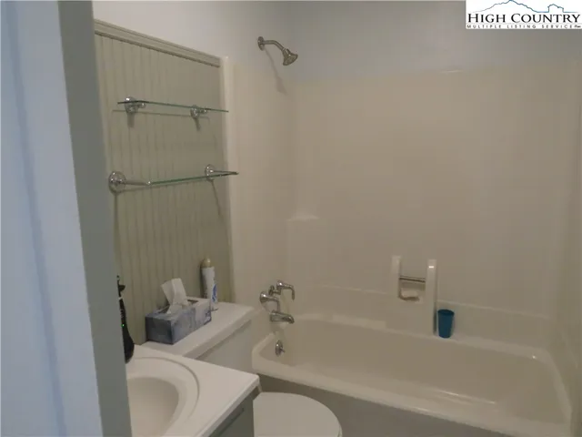 a bathroom with a sink and toilet