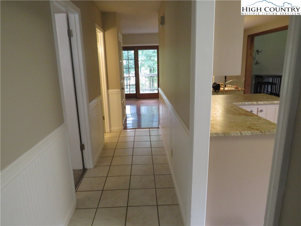 296 Silo Road Sparta, NC 28675 - Photo 19 of 24 a view of a hallway view with wooden floor and staircase