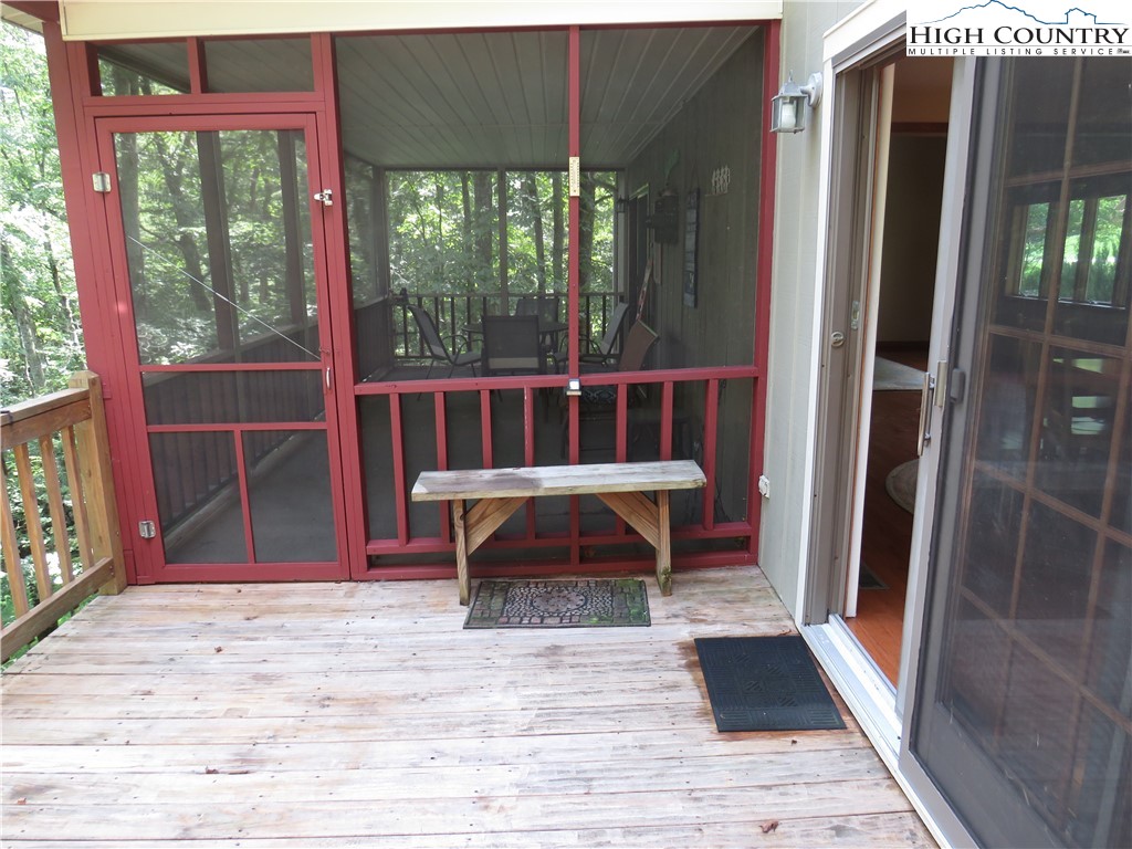 296 Silo Road Sparta, NC 28675 - Photo 23 of 24 a view of balcony with wooden floor and outdoor seating