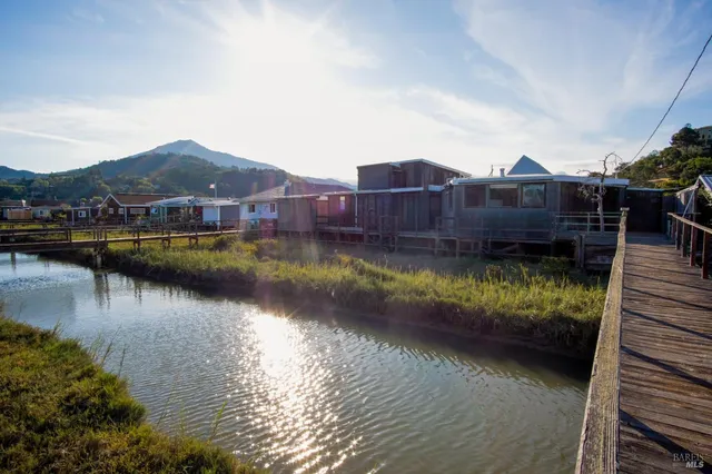 a view of a lake with a house in the background