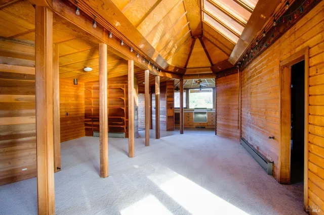 a view of a room with wooden walls