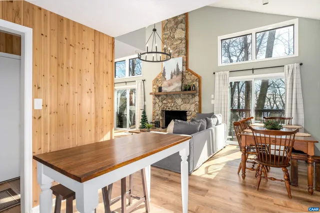 a view of a livingroom with furniture window and wooden floor