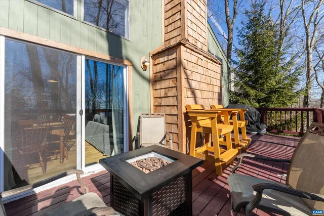 a view of a chairs and table in the balcony