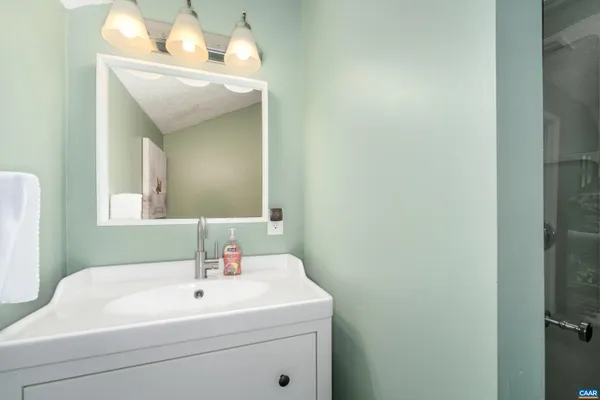 a bedroom with baby crib and a cabinet