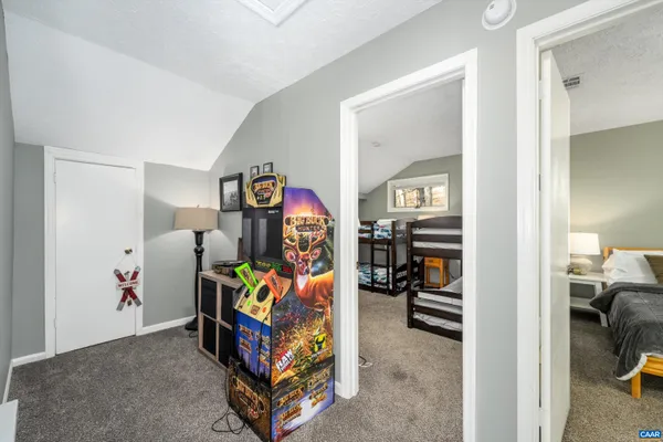 a bedroom with a bed and a table in it