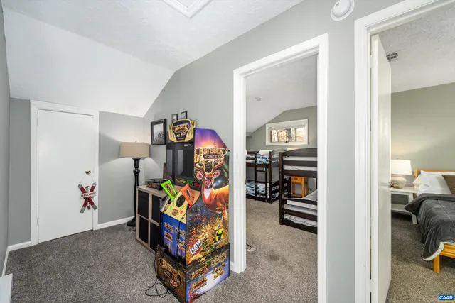 a bedroom with a bed and a table in it