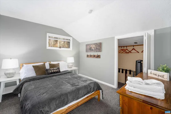 a view of a dry yard with wooden floor and mountain view
