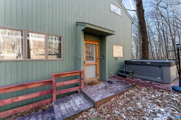 a living room with a couch and a table with wooden floor