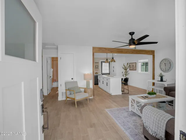 a living room with furniture and a window