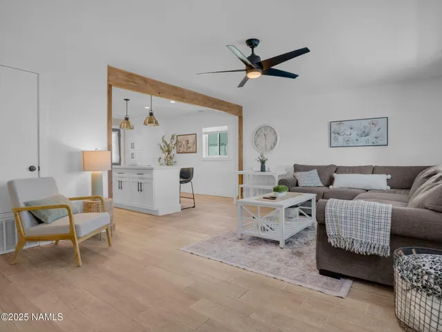 a living room with furniture and white walls
