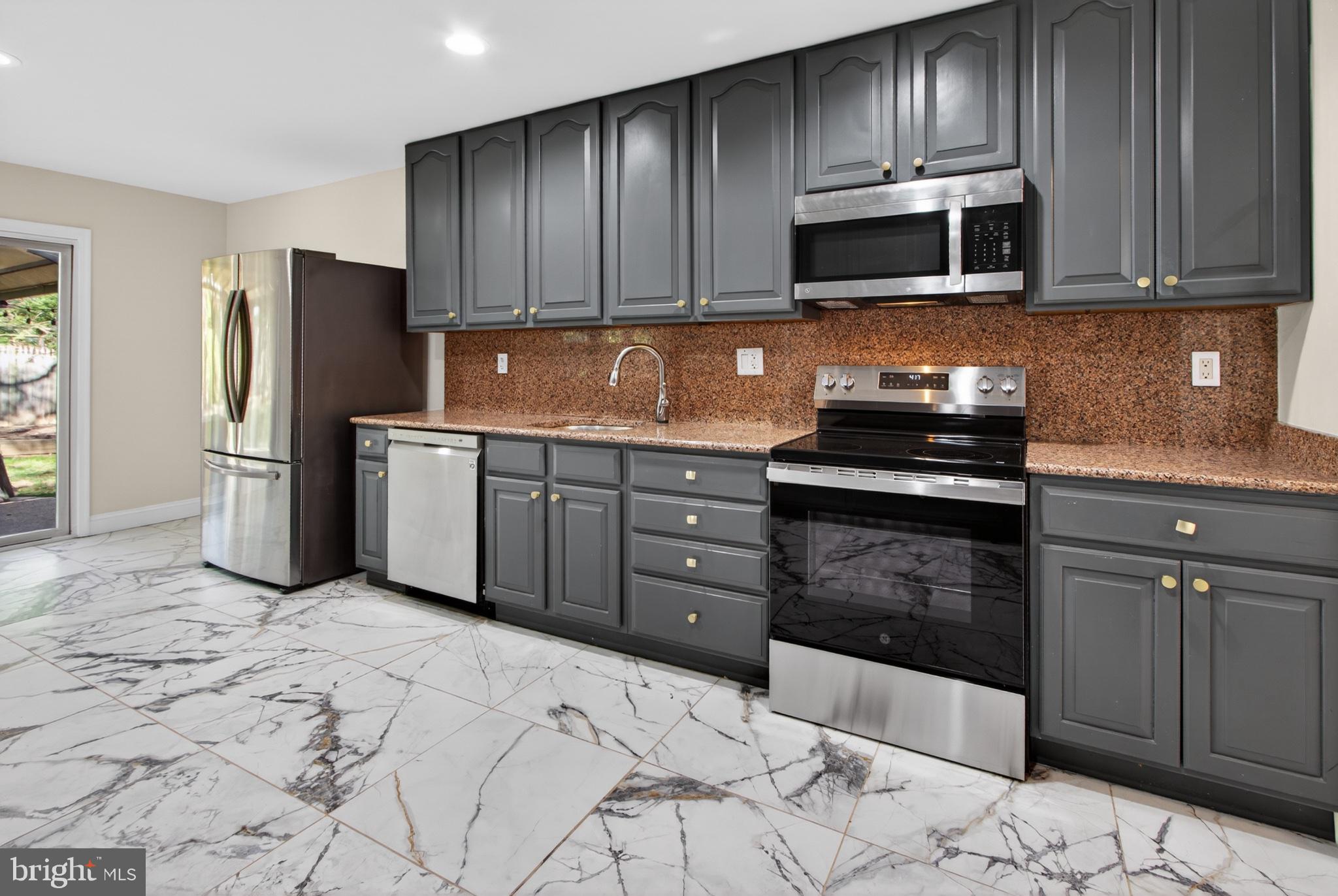 16 Redding Ridge Drive Gaithersburg, MD 20878 - Photo 15 of 53 Sleek kitchen with modern finishes.