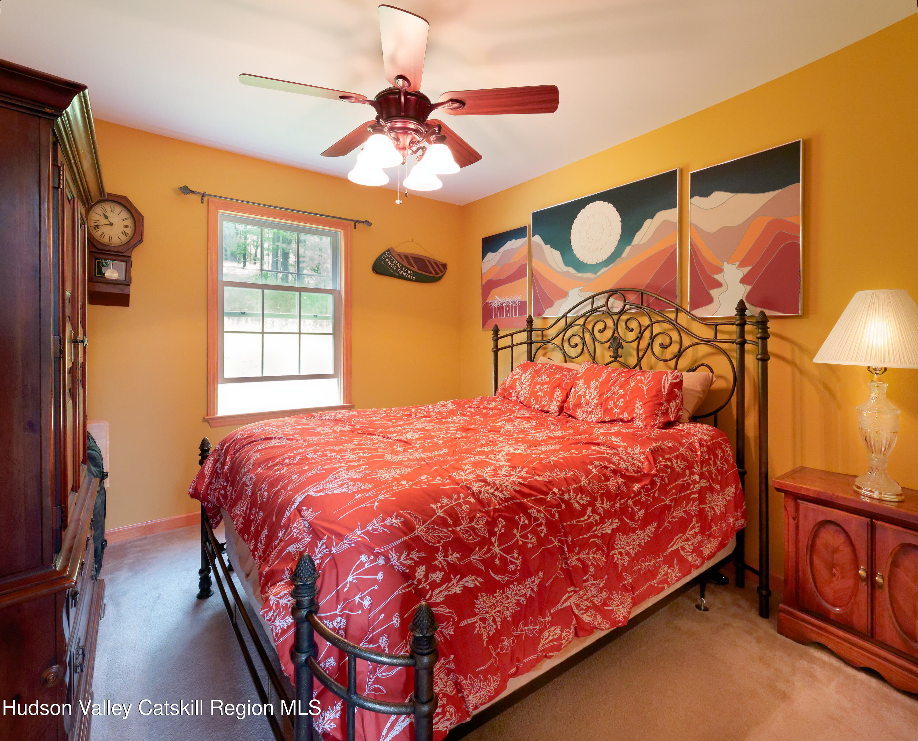 1324 Hauverville Road Middleburgh, NY 12122 - Photo 13 of 28 a bedroom with a bed and a chandelier