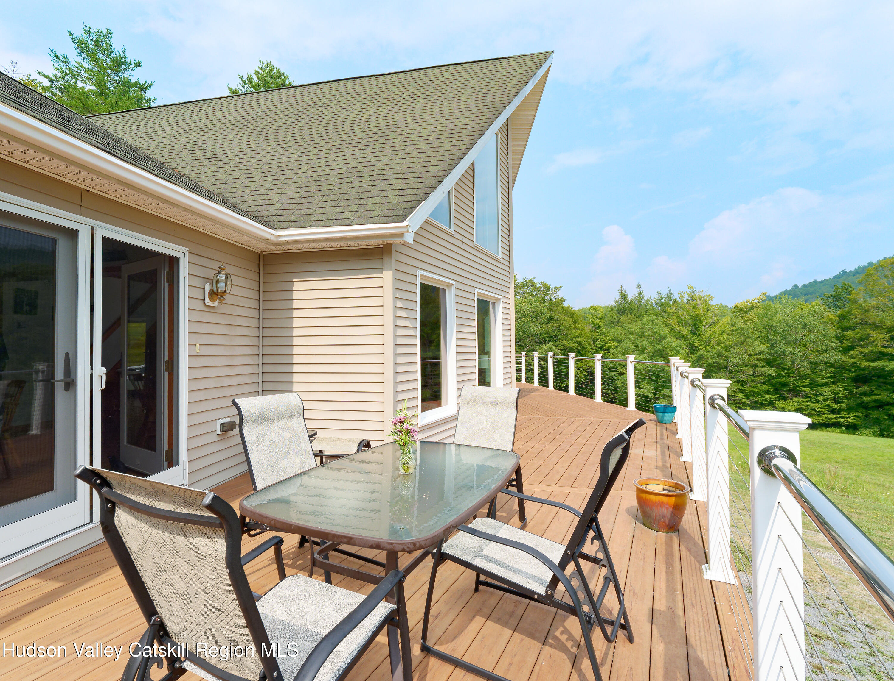 1324 Hauverville Road Middleburgh, NY 12122 - Photo 16 of 28 a view of a patio with a table and chairs