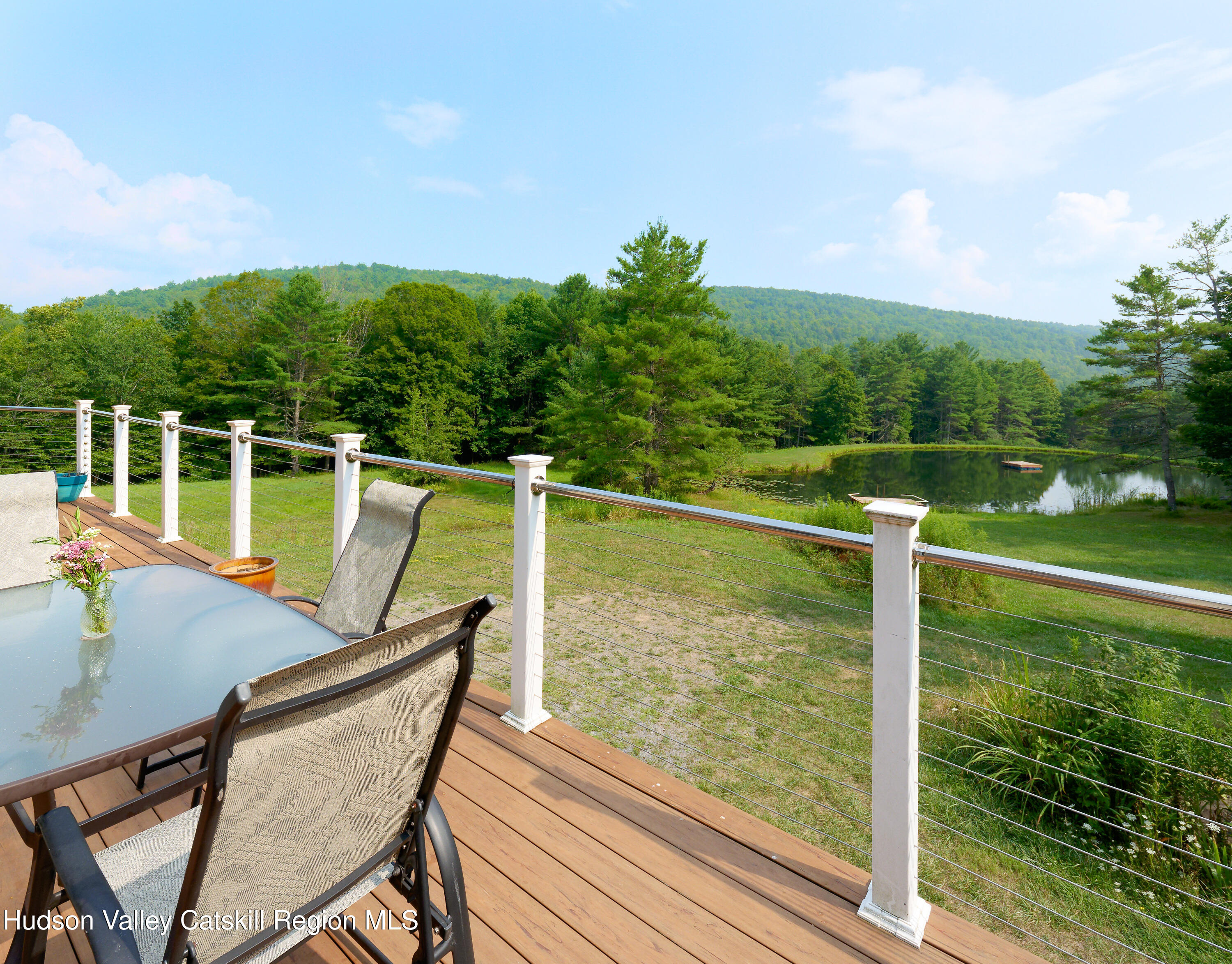 1324 Hauverville Road Middleburgh, NY 12122 - Photo 18 of 28 a view of a chairs and table on the deck