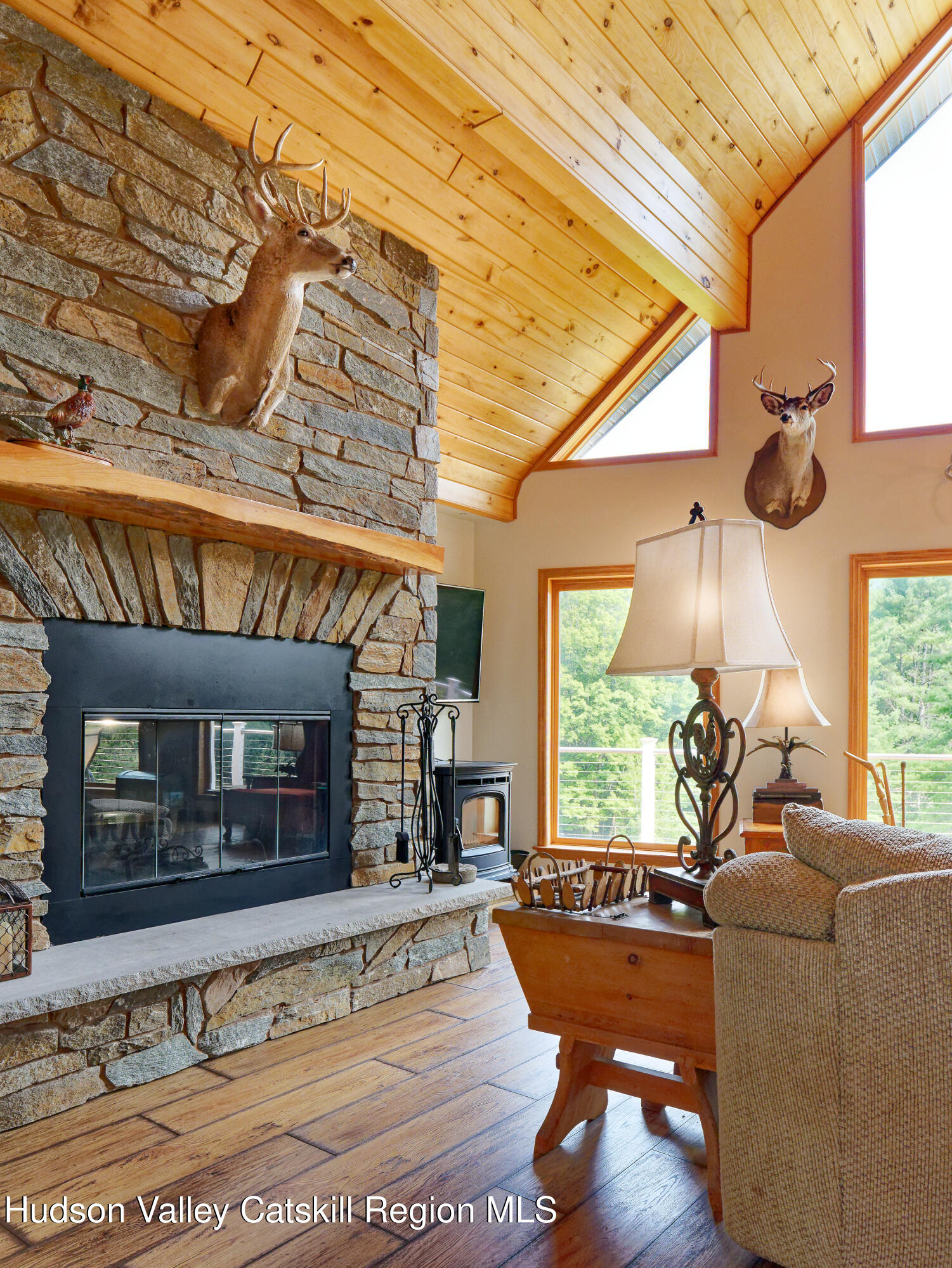 1324 Hauverville Road Middleburgh, NY 12122 - Photo 6 of 28 a living room with fireplace furniture and a large window