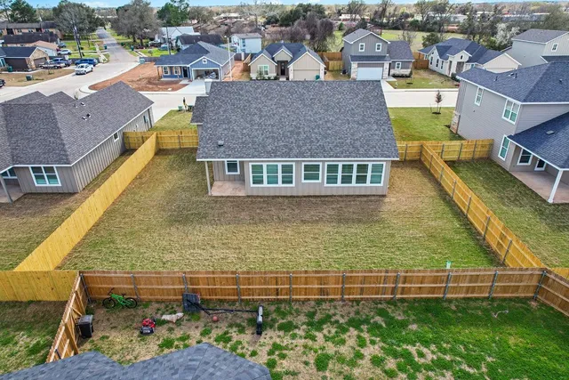 an aerial view of a house with a garden
