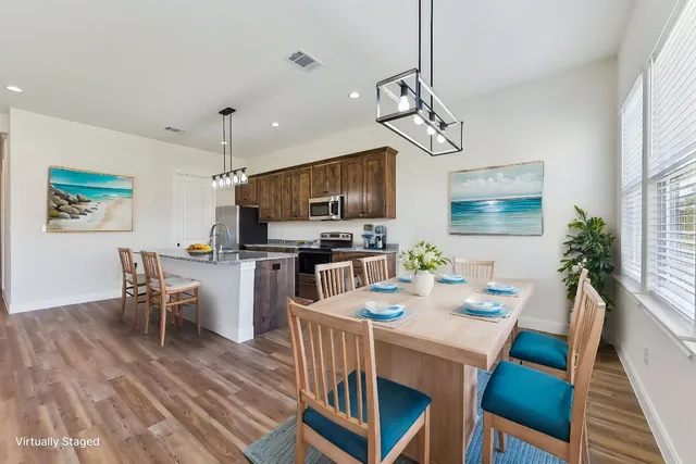 a view of hallway with wooden floor