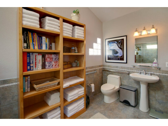 105 Corralitos Road Corralitos, CA 95076 - Photo 23 of 25 a bathroom with a toilet sink and a mirror