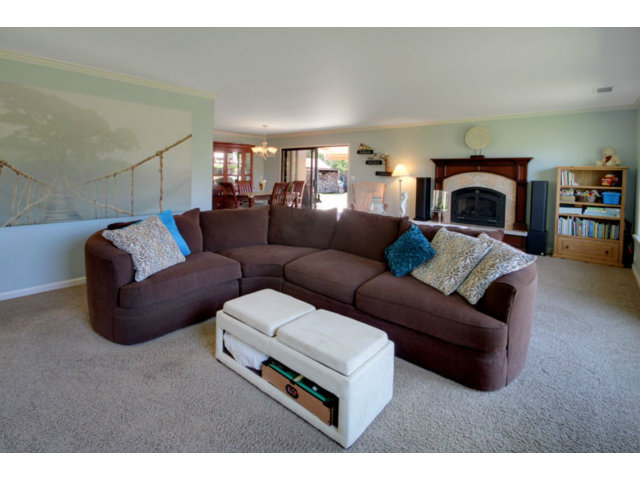 105 Corralitos Road Corralitos, CA 95076 - Photo 5 of 25 a living room with furniture and a fireplace