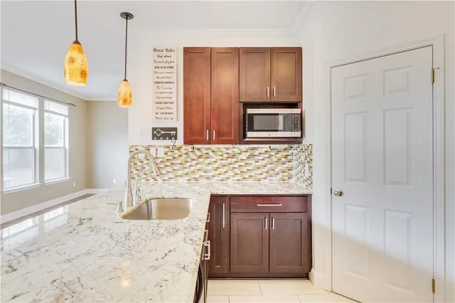 a kitchen with a stove and a refrigerator