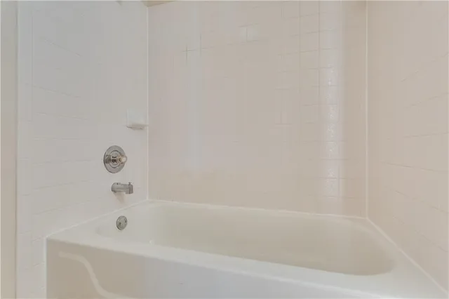 a close up of a bathtub in a bathroom