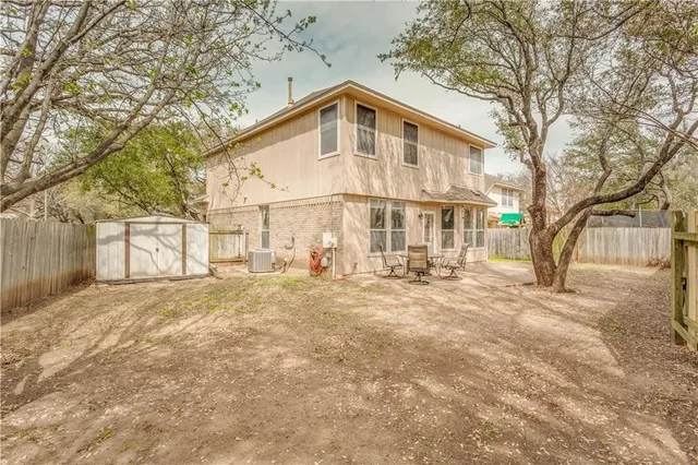 a front view of a house with a yard covered in snow