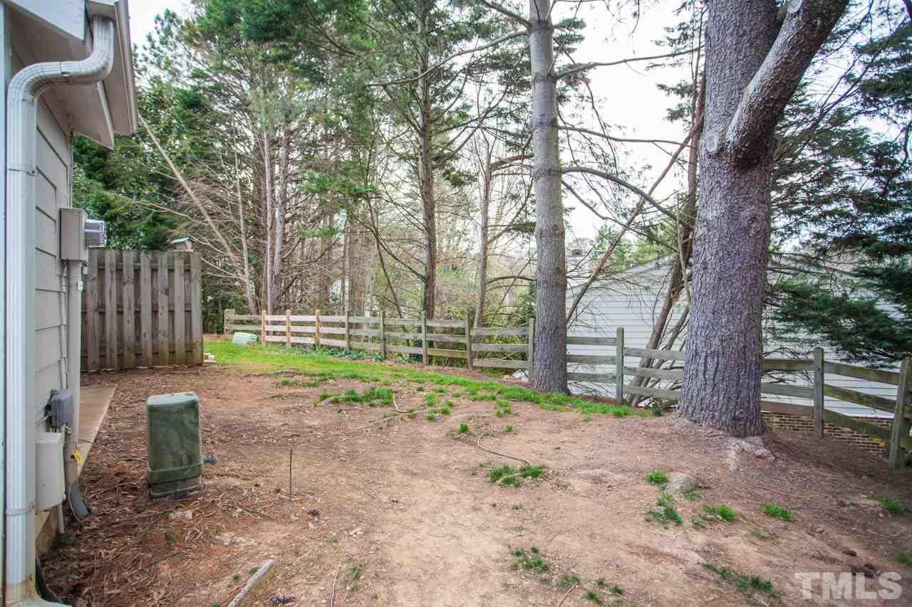 7900 Falcon Rest Circle, Unit 10 Raleigh, NC 27615 - Photo 25 of 25 a backyard of a house with lots of green space