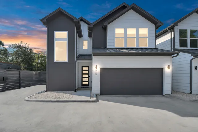 a front view of a house with a garage