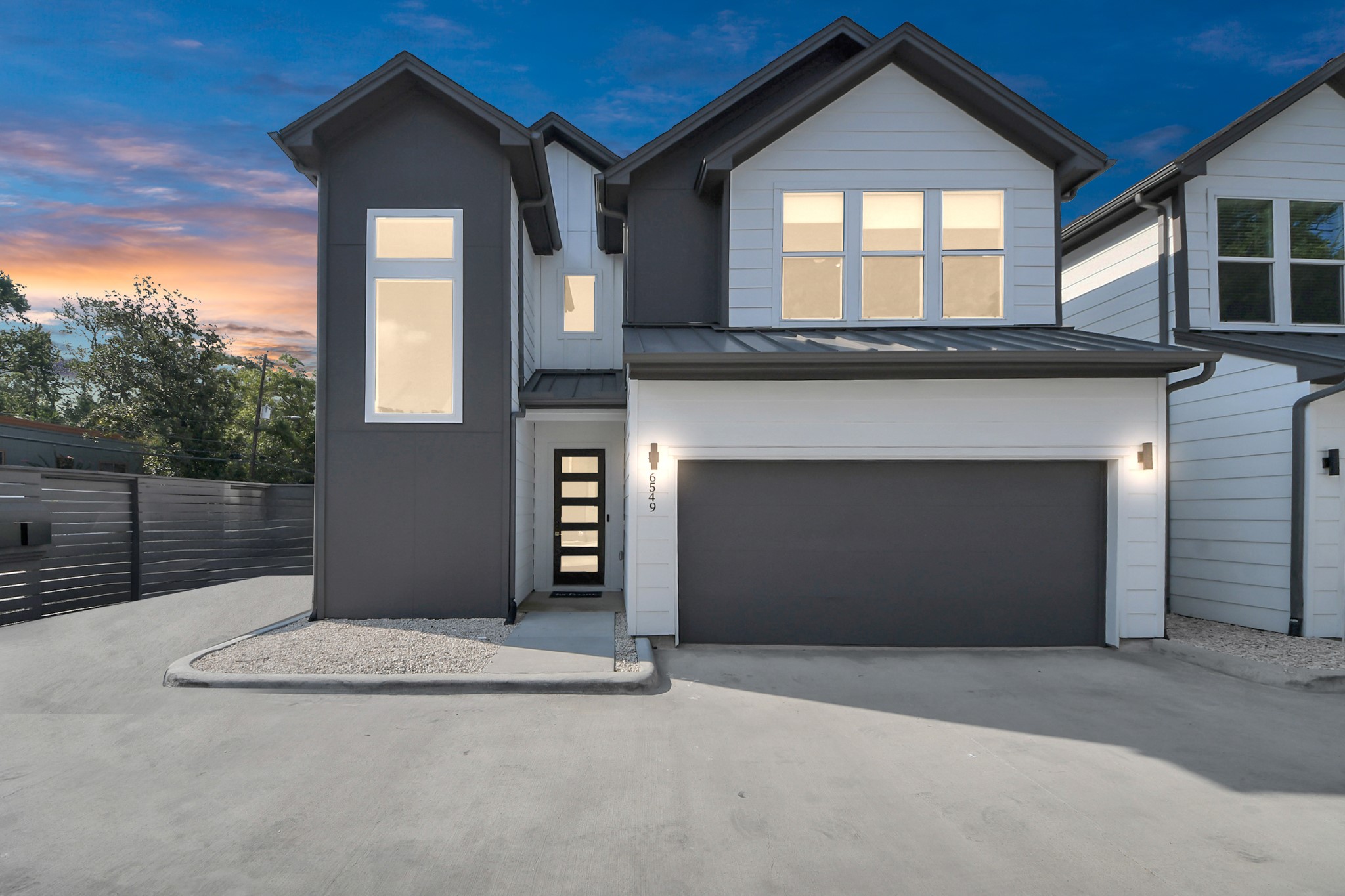a front view of a house with a garage