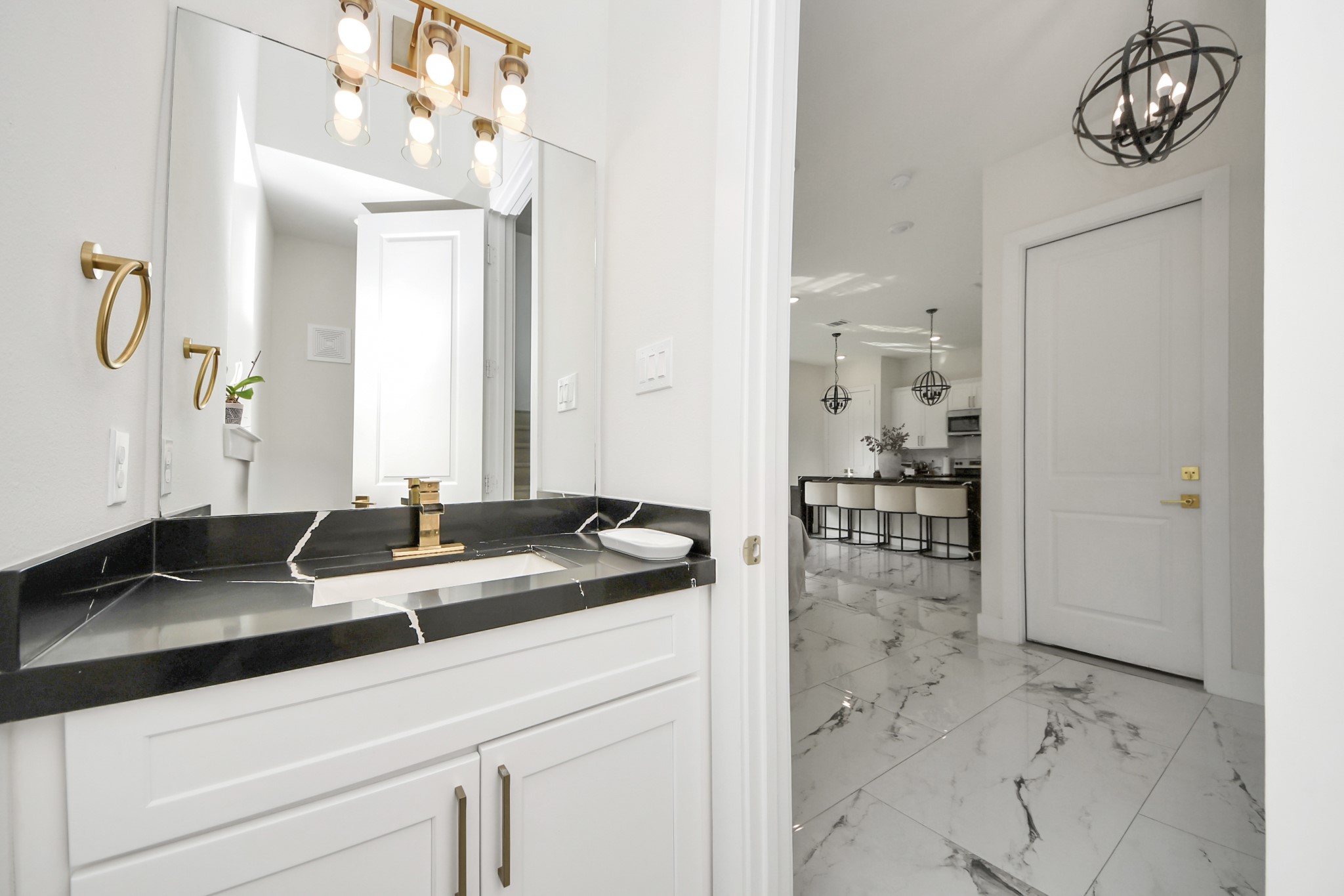 6549 Sealey Street Houston, TX 77091 - Photo 14 of 40 a bathroom with a granite countertop sink and a mirror