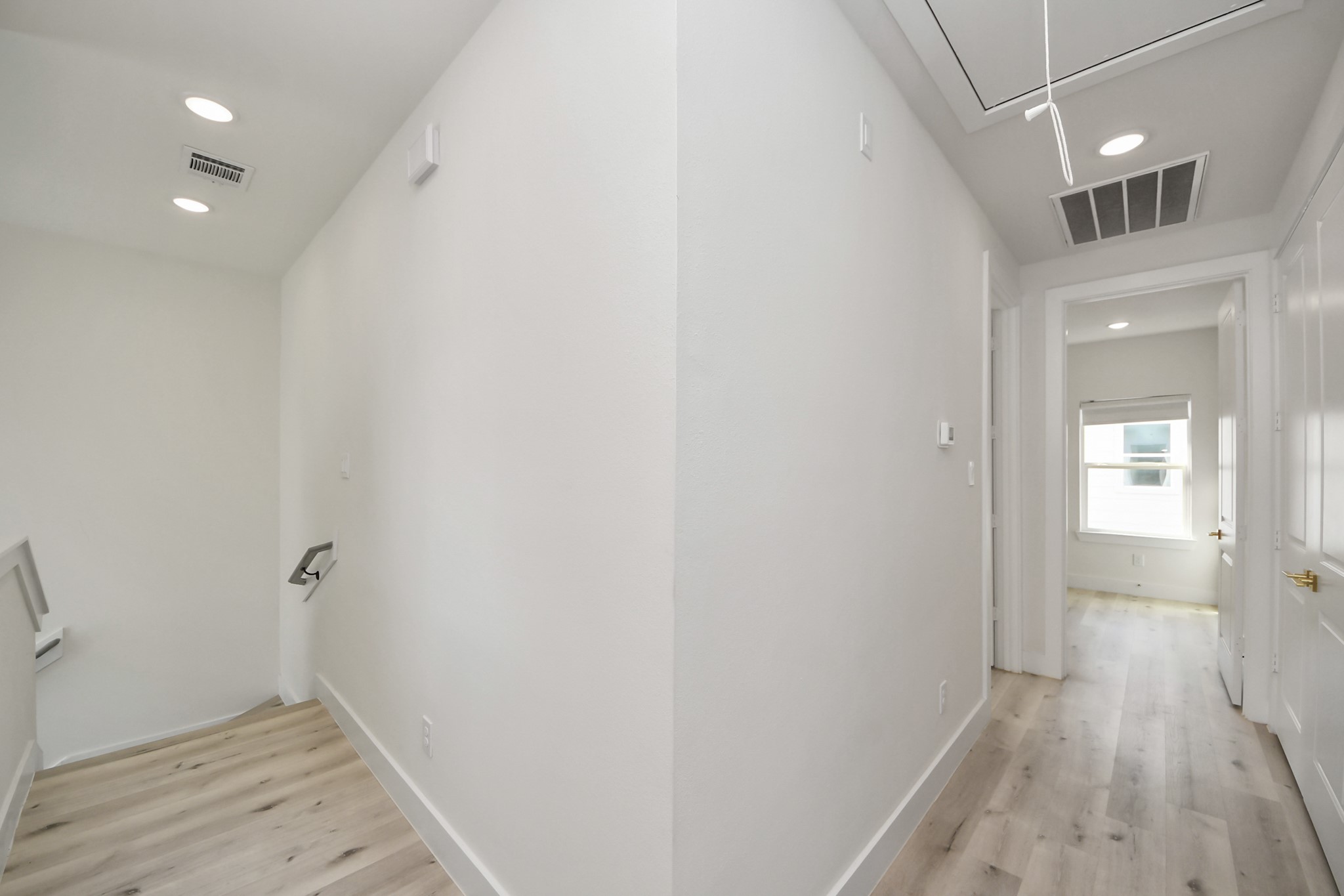 6549 Sealey Street Houston, TX 77091 - Photo 17 of 40 a view of hallway with wooden floor