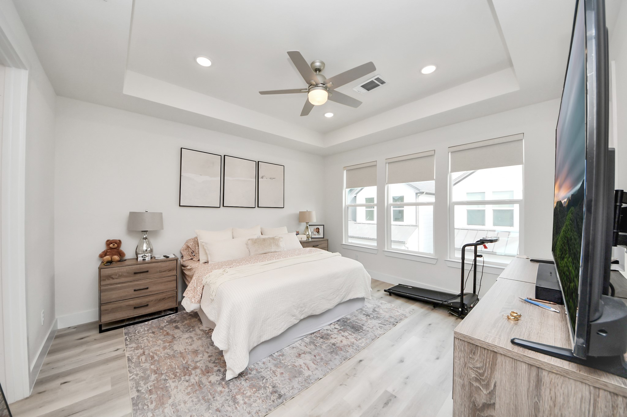 6549 Sealey Street Houston, TX 77091 - Photo 18 of 40 a bedroom with a bed flat screen tv and a large window