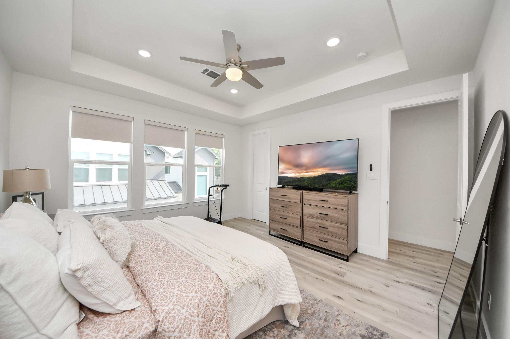 6549 Sealey Street Houston, TX 77091 - Photo 21 of 40 a bedroom with a bed and a flat screen tv