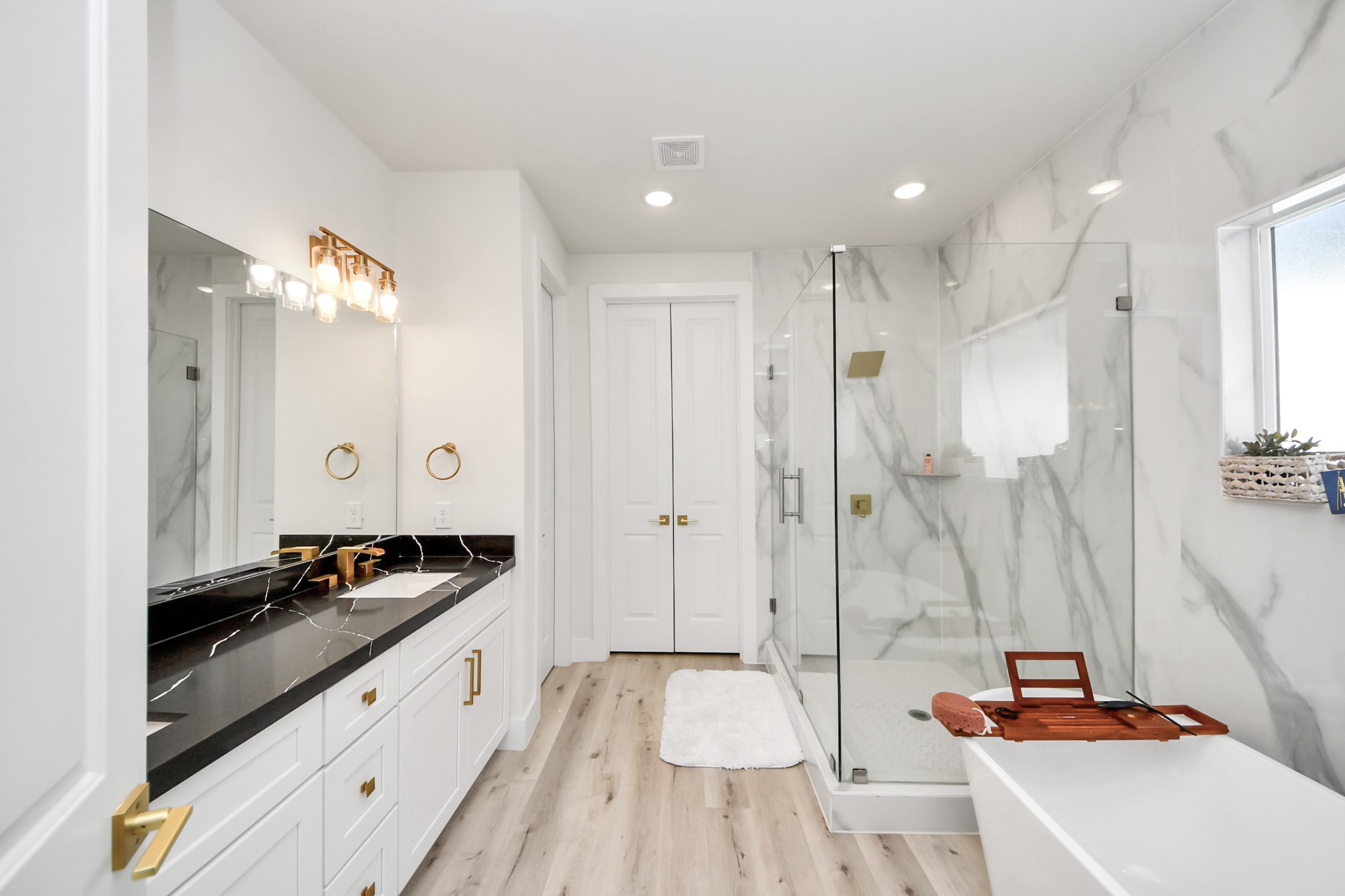 6549 Sealey Street Houston, TX 77091 - Photo 22 of 40 a bathroom with a double vanity sink and mirror