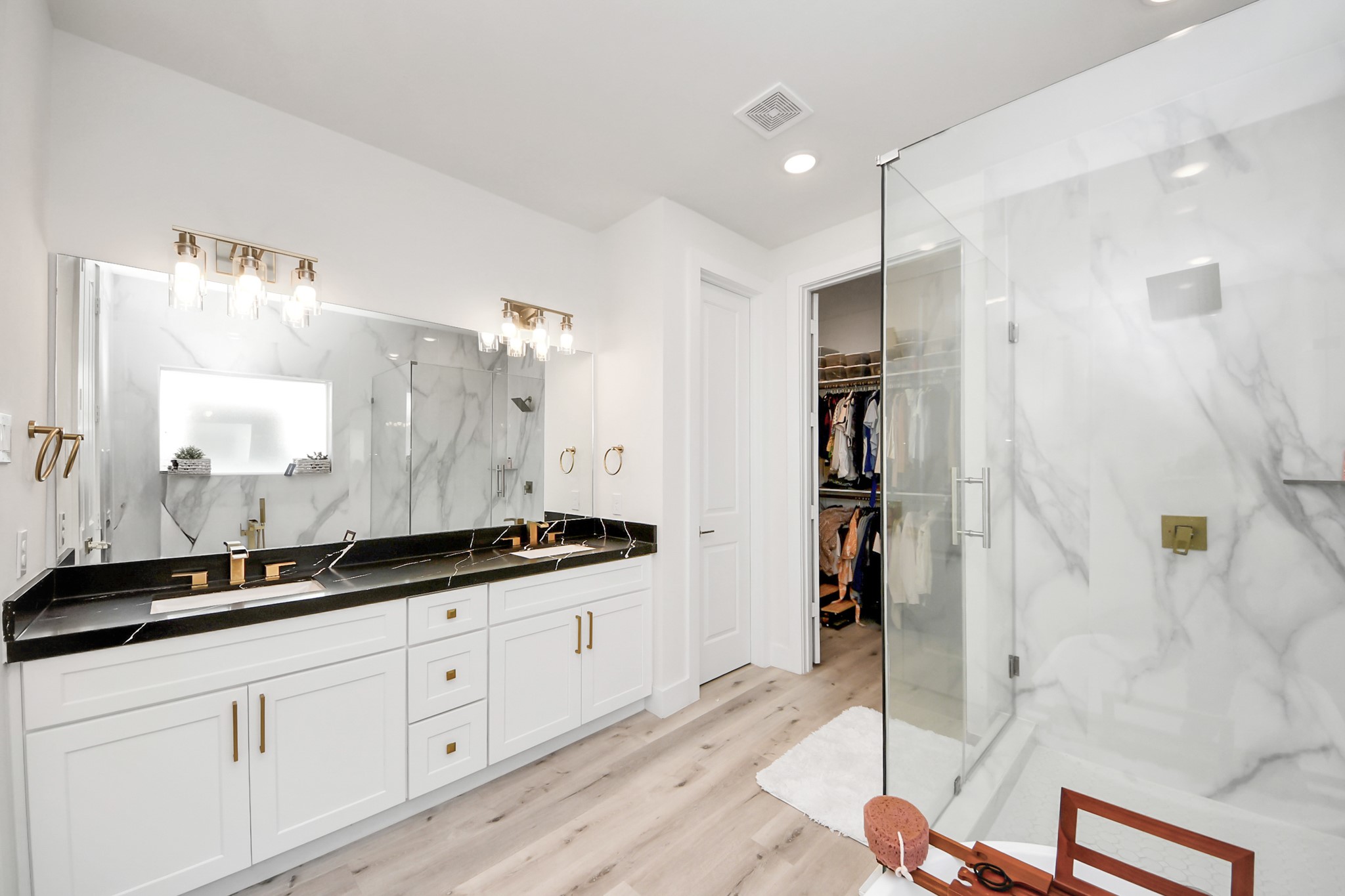 6549 Sealey Street Houston, TX 77091 - Photo 24 of 40 a bathroom with a double vanity sink and mirror
