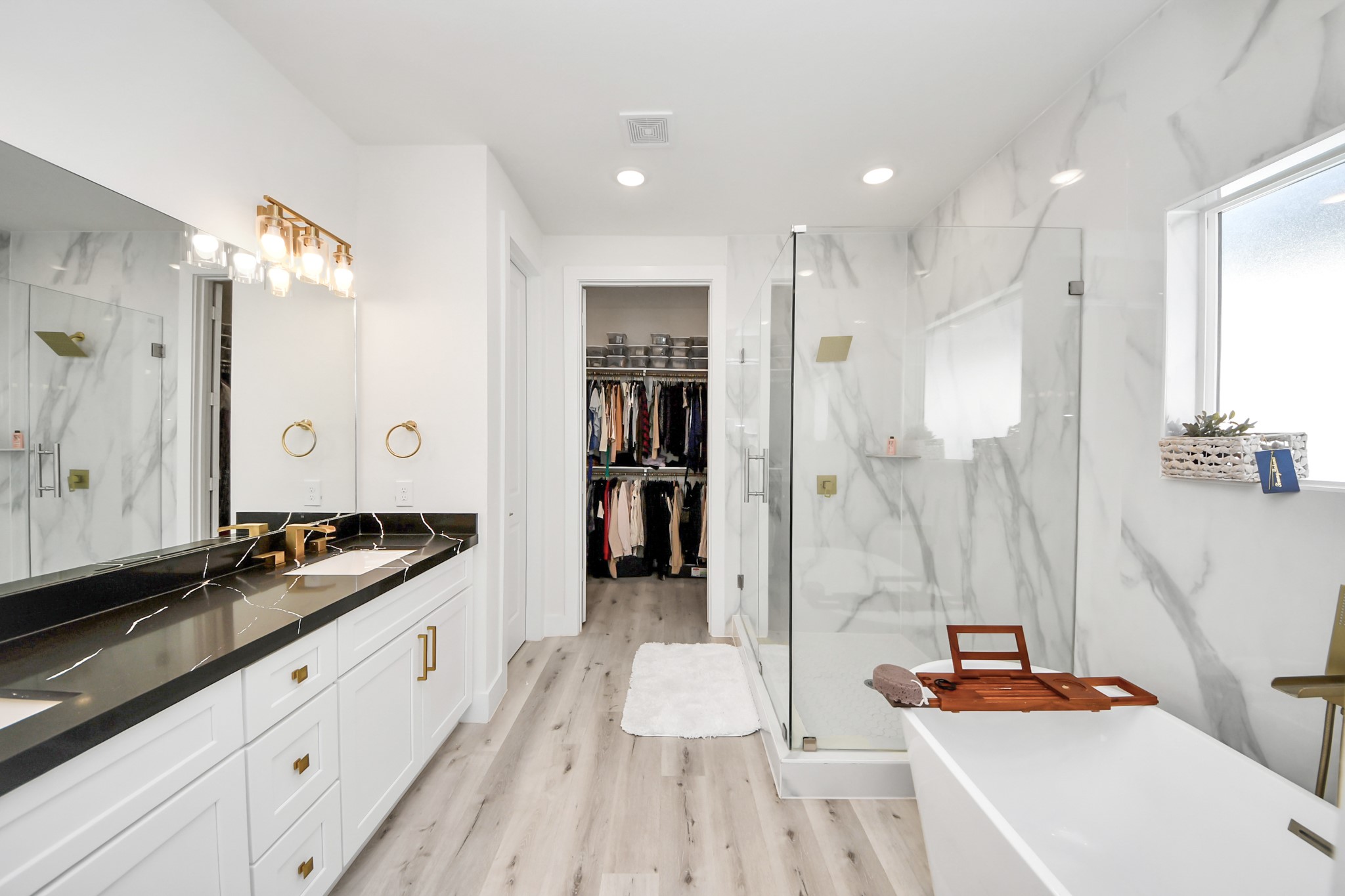 6549 Sealey Street Houston, TX 77091 - Photo 25 of 40 a large white kitchen with a sink and a refrigerator