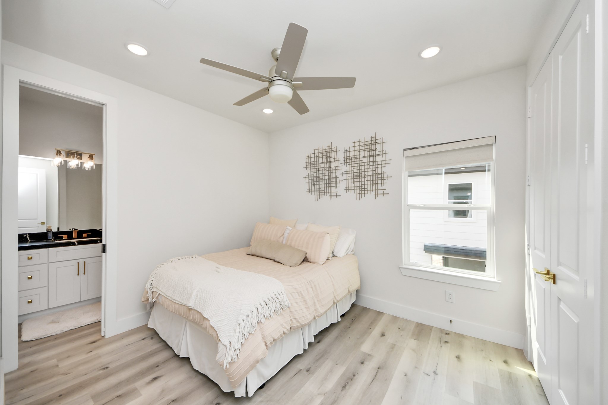 6549 Sealey Street Houston, TX 77091 - Photo 27 of 40 a bedroom with a large bed and a window