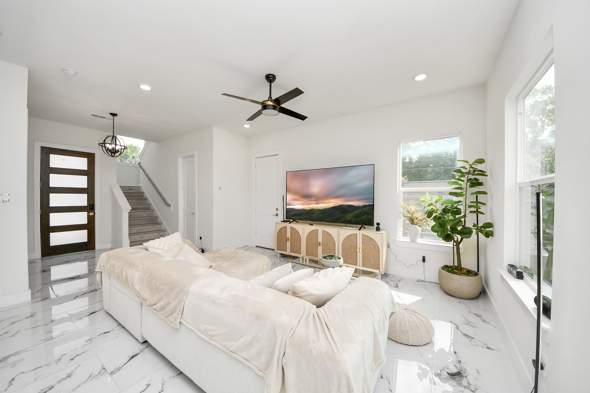 6549 Sealey Street Houston, TX 77091 - Photo 3 of 40 a bedroom with furniture and a flat screen tv