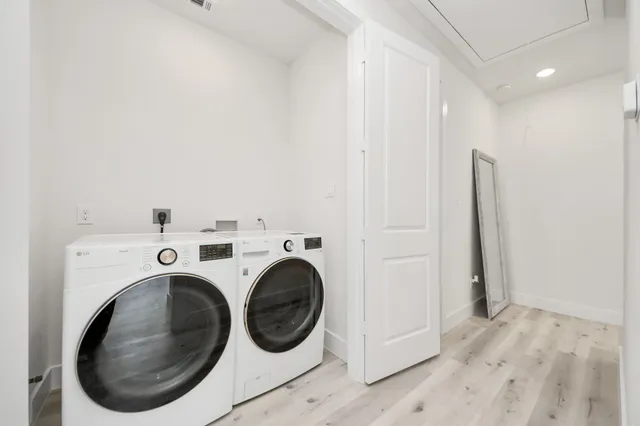 a view of a storage & utility room with washer and dryer