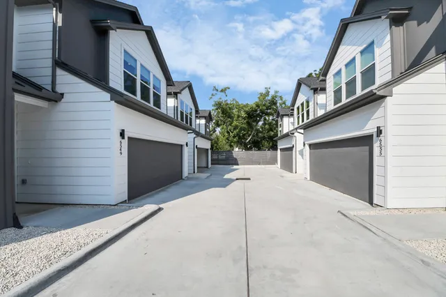 a front view of a house with garage