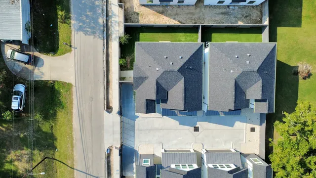 an aerial view of a house with swimming pool