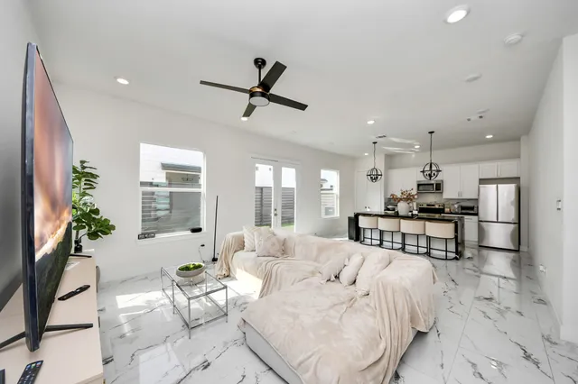 a living room with furniture and a large window