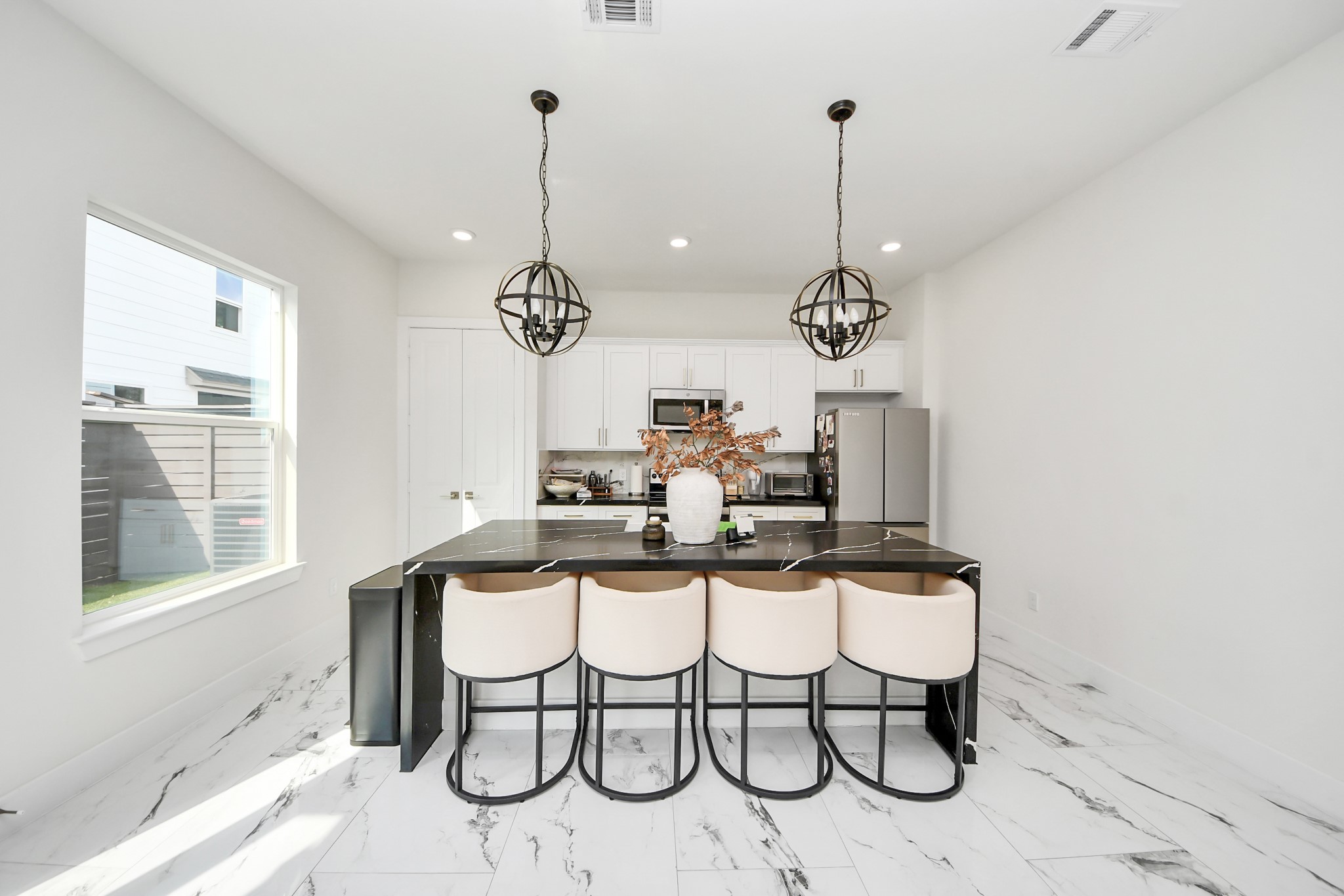 6549 Sealey Street Houston, TX 77091 - Photo 7 of 40 a table and chairs in a room