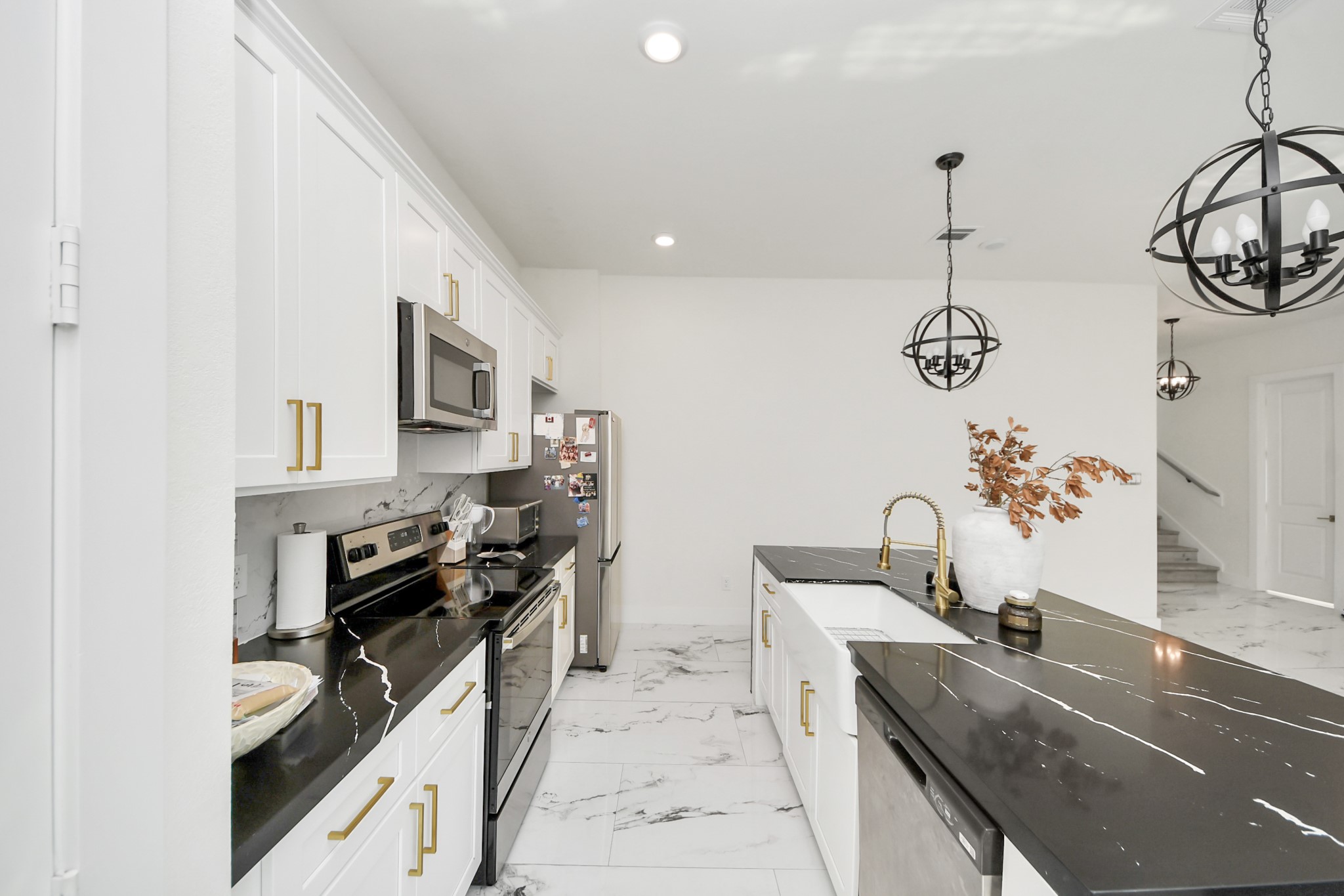 6549 Sealey Street Houston, TX 77091 - Photo 8 of 40 a kitchen that has a lot of cabinets and appliances