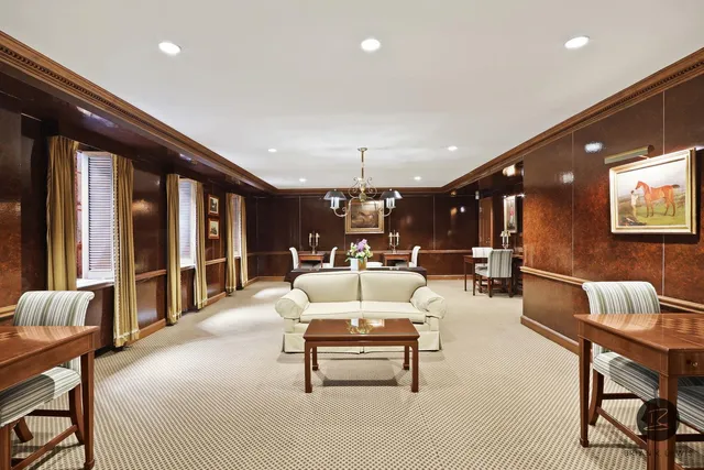 a room with furniture and pool table