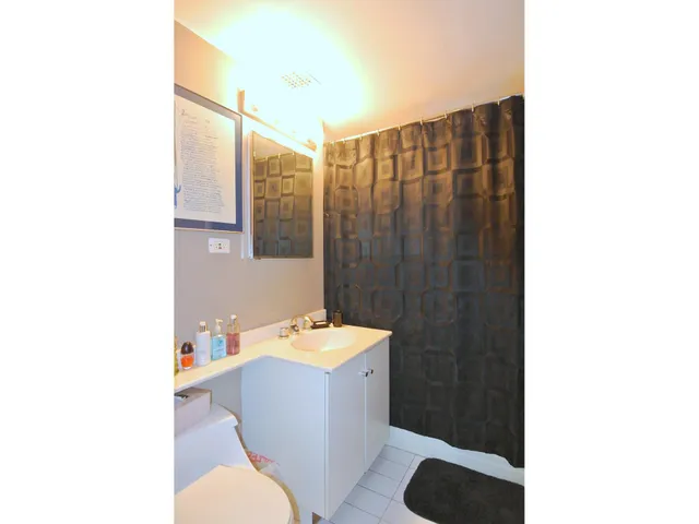 a bathroom with a sink and mirror