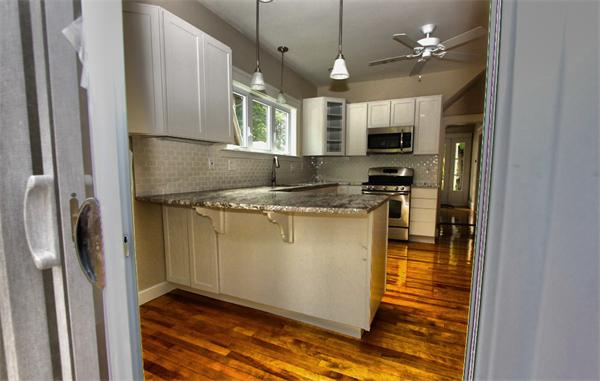 28 Woodman Road Worcester, MA 01602 - Photo 30 of 30 a kitchen with stainless steel appliances granite countertop a refrigerator a stove a sink and a refrigerator